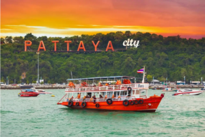 A picturesque Patong Beach scene featuring a boat, representing an exciting tour and travel opportunity.