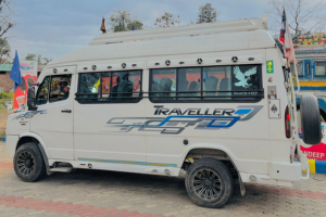 A white tour bus featuring a blue and black logo, designed for travel and exploration.